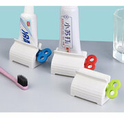 Пресс дозатор для зубной пасты Подходит для любых тюбиков шириной до 56 мм. Имеет подставку, благодаря которой удобно ставить дозатор.