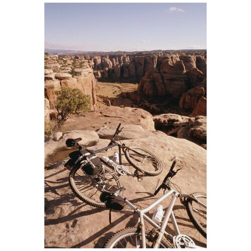 фото Постер на холсте велосипеды на скале 30см. x 45см. твой постер