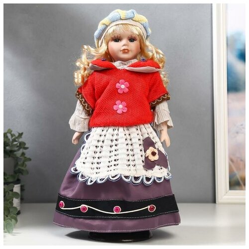 фото Кукла коллекционная керамика "блондинка с кудрями, алый свитер с цветочками" 40 см нет бренда