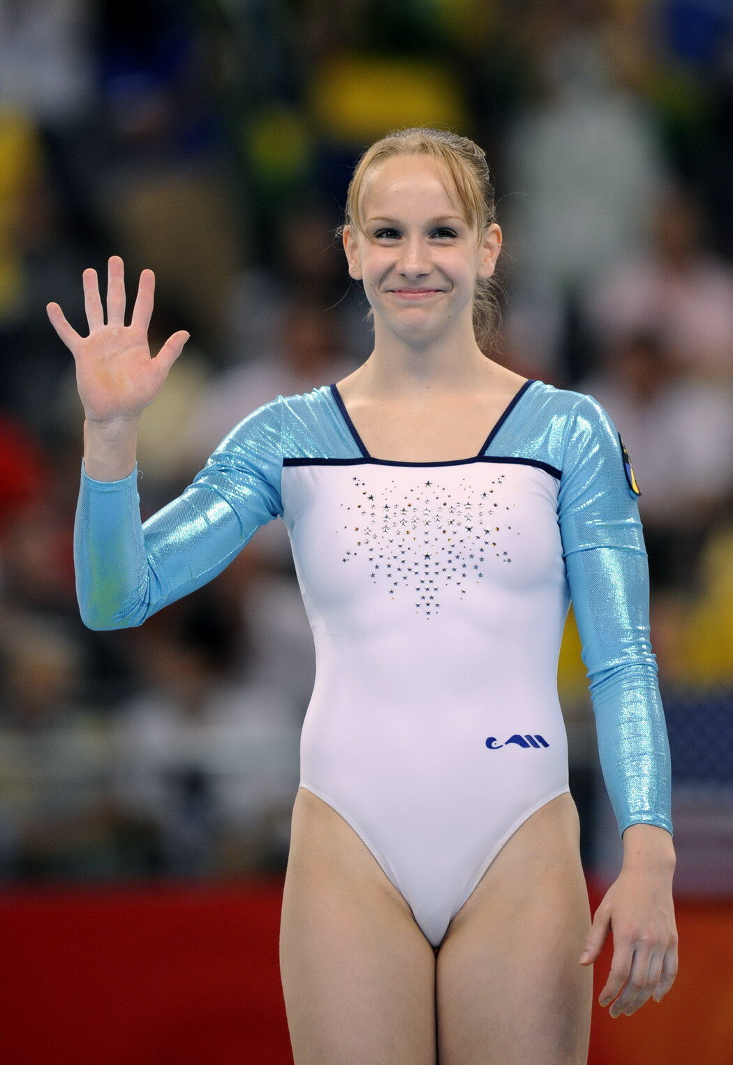 girl in white/blue gym suit 1050x1525