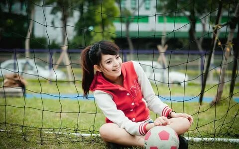 Asian girl playing soccer