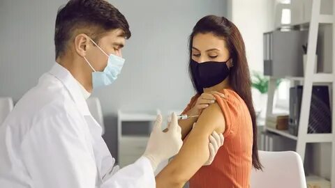 Picture of nurse giving flu shoot in boob