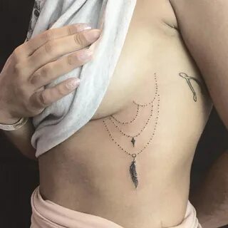 Side boob wing tattoo