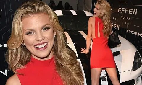 Annalynne McCord drapes herself over a car at Playboy Super 