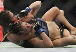 Cynthia Calvillo uses a submission hold on Pearl Gonzalez du