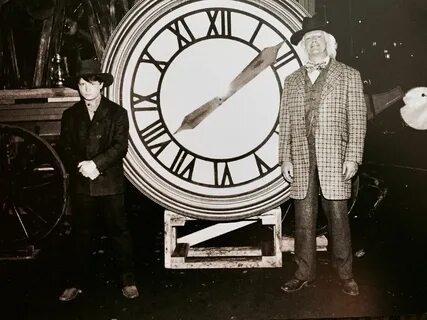 Marty and Doc in 1885 in front of the tower clock. Back to t