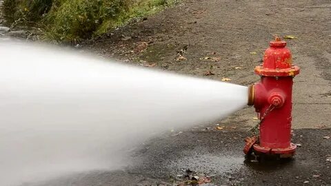 fire hydrant flowing water out steamer Stock Footage Video (