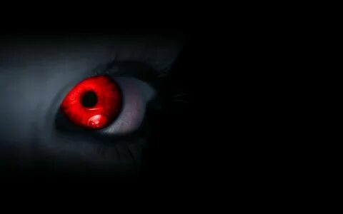 pure red eye in darkness making feel someone is tracking you