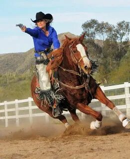 COWGIRL SHOOTING competition on horseback. Mounted shooting,