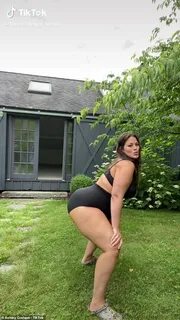 Pregnant Ashley Graham strips down to just her underwear whi