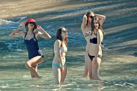 Taylor Swift wearing retro polka-dot swimsuit at the beach i