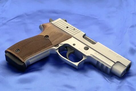 Sig-Sauer P220ST with Nill grips on Behance