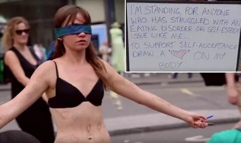 Jae West strips in London's Piccadilly Circus to raise aware