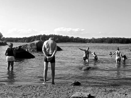 Black and white photo of people swimming in the lake free im