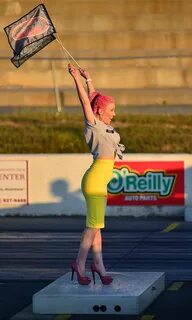 Retro drag racing flag girl At the Steel In Motion nostalg. 