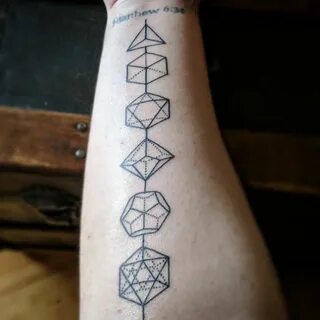 A set of D&D dice by Eric Mueller at Mid Town Tattoo in Erie