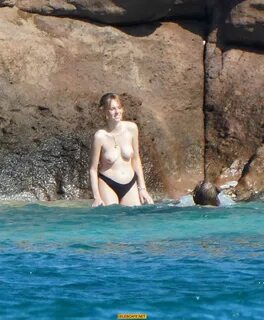 Maya Hawke topless on a beach at St. Barts with her mom Uma 