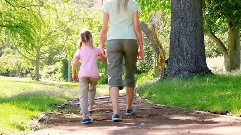 mother daughter walking together park: стоковое видео (без л