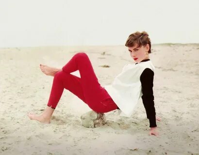 Audrey Hepburn poses on the beach wearing her signature capr