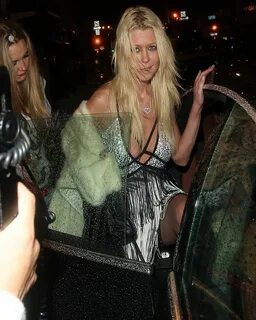 Tara Reid looks worse for wear as she takes a FALL outside a