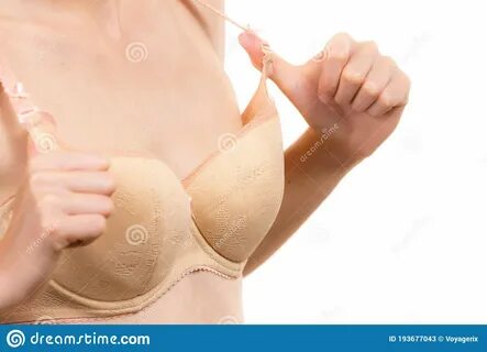 Slim young woman small boobs wearing too big bra. 