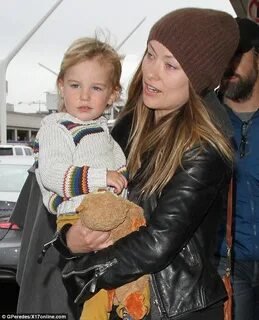 Olivia rocks a scarf and beanie with fiance Jason Sudeikis a