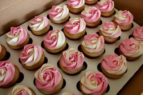 Pink & white coloured colored rosette swirls cupcakes butter