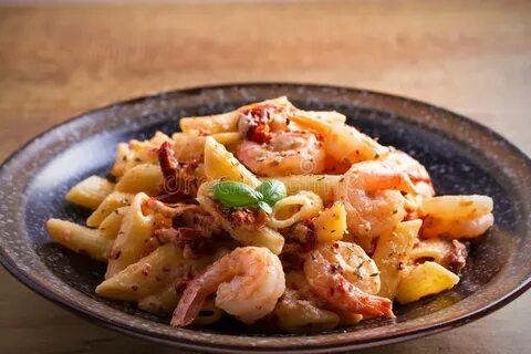 Shrimp Penne with Sun Dried Tomatoes and Basil in Creamy Moz