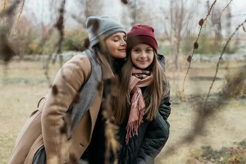 Photo of happy two sisters in autumn park free image downloa