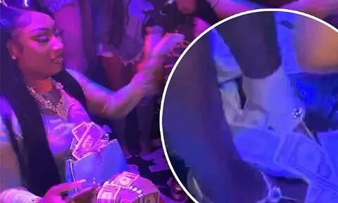 Megan Thee Stallion bandages her foot as she celebrates the 