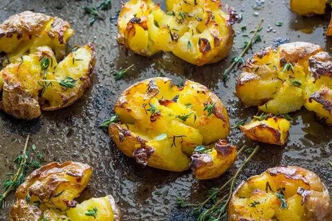 Smashed Potatoes baked with garlic, olive oil and herbs, flu