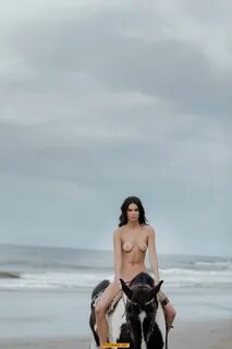 Kendall Jenner naked at horse on a beach