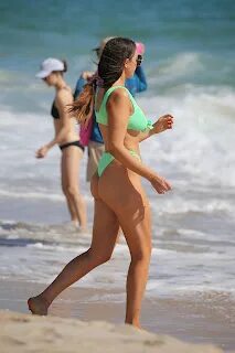 Victoria Larson - In a neon green bikini on the beach in Ft.