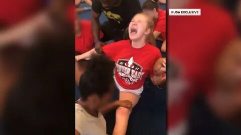 Cheerleaders forced into painful splits in disturbing videos