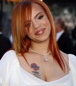 Faith Evans Tattoo on her Chest Faith evans, Celebrity tatto