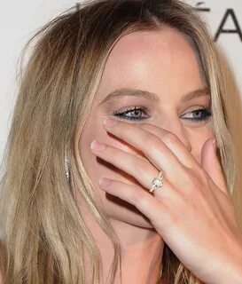 Margot Robbie flashes her wedding ring on first red carpet s