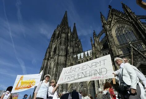 Human chain rings German cathedral to demand gender equality