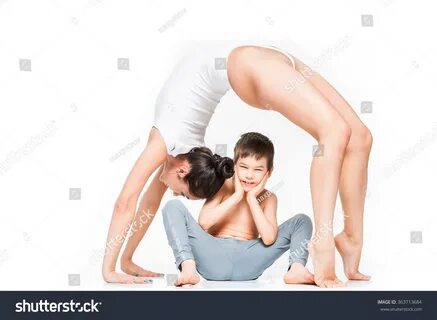 Стоковая фотография 363713684: Mom Doing Yoga Bridge Pose Ov