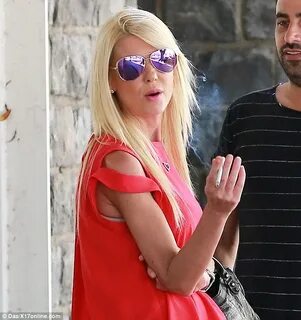 Tara Reid puts her painfully thin arms on display in Beverly