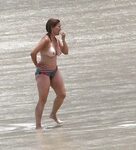Marilyn Milian caught topless on a beach
