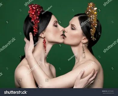 Стоковая фотография 200756801: Twin Sisters Kissing Each Oth
