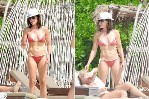 Luann de Lesseps shows off her toned abs on the beach