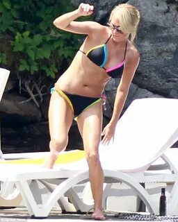 Carrie Underwood makes a splash in a colourful bikini... bef