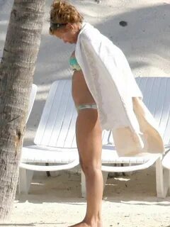 Billie Piper relaxing topless at the beach - April 22, 2008 