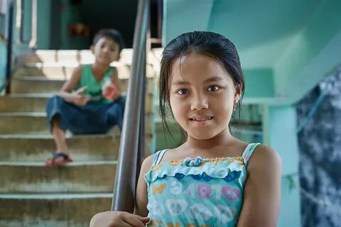 Little Cambodian girl in the stairs, White Building, Phnom. 