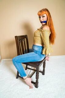 Ginger chick in denim pants enjoys bondage session photos