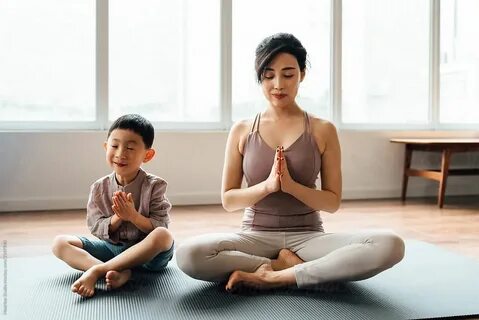 Mother And Son Practicing Yoga At Home by MaaHoo Studio Moth