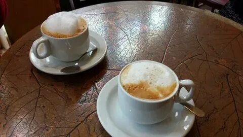 Left: Cappuccino. Right: Latte - Picture of Au Grain de Cafe