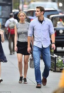 Jennifer Lawrence enjoys a stroll with her hunky bodyguard J