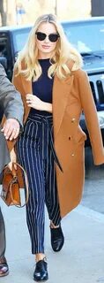 Who made Margot Robbie’s tan coat and brown handbag? Clothes